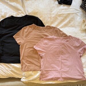 Three lululemon athletica classic fit cotton Short Sleeve Tees —Black, Tan, Pink